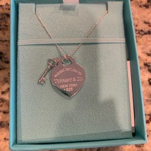 Tiffany & Co. heart tag with key pendant.